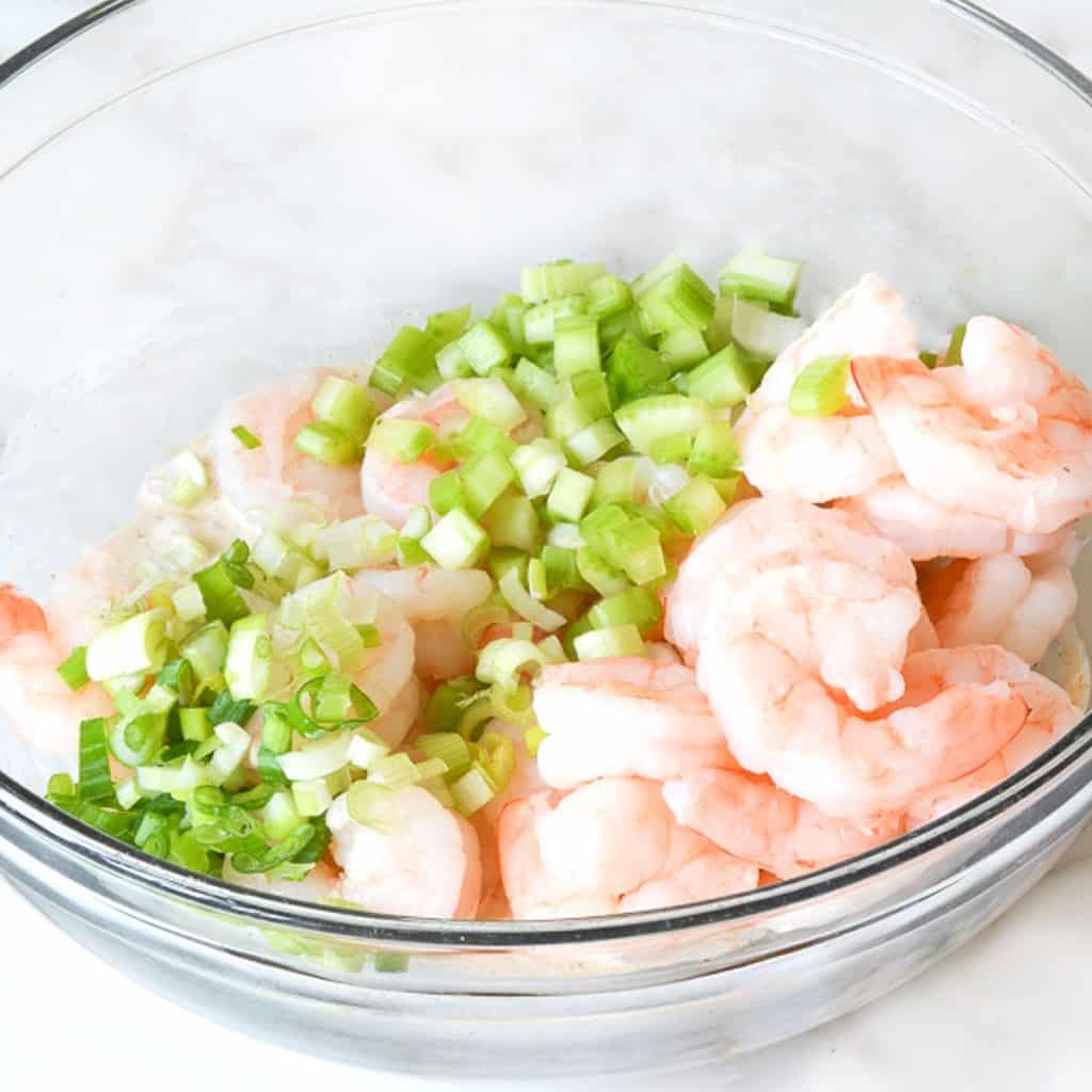 shrimp and green onions in a bowl
