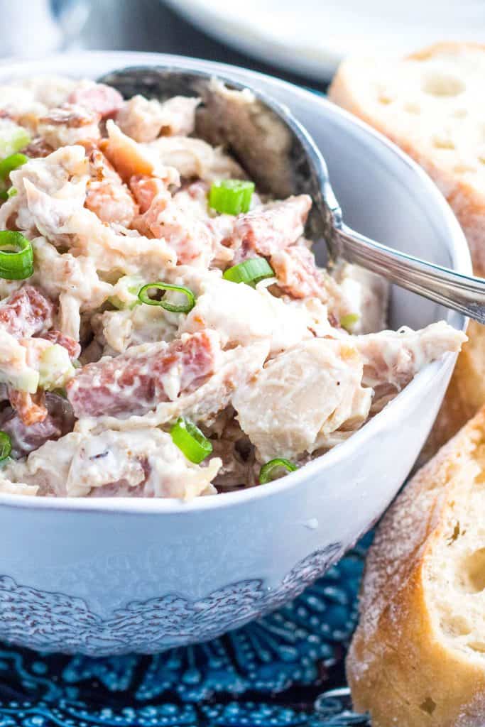 A close up of a plate of food, with Chicken and Salad