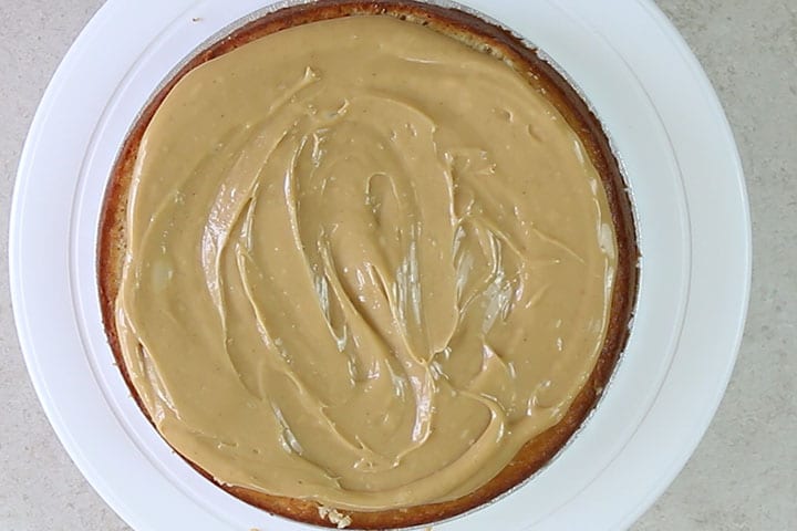 The caramel filling spread over the cake