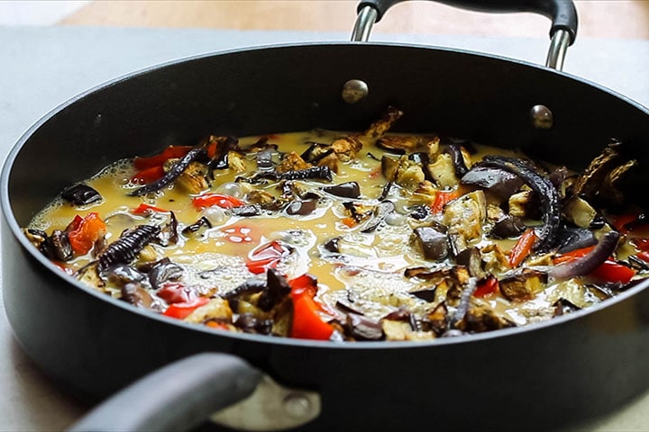 the eggs added to the vegetables in the pan