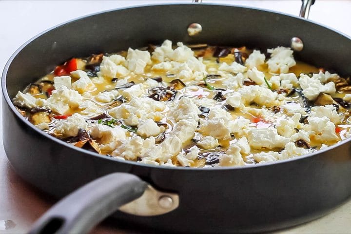 The feta crumbled over the egg and vegetable mixture