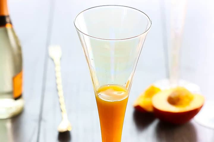 A flute glass filled a third of the way full