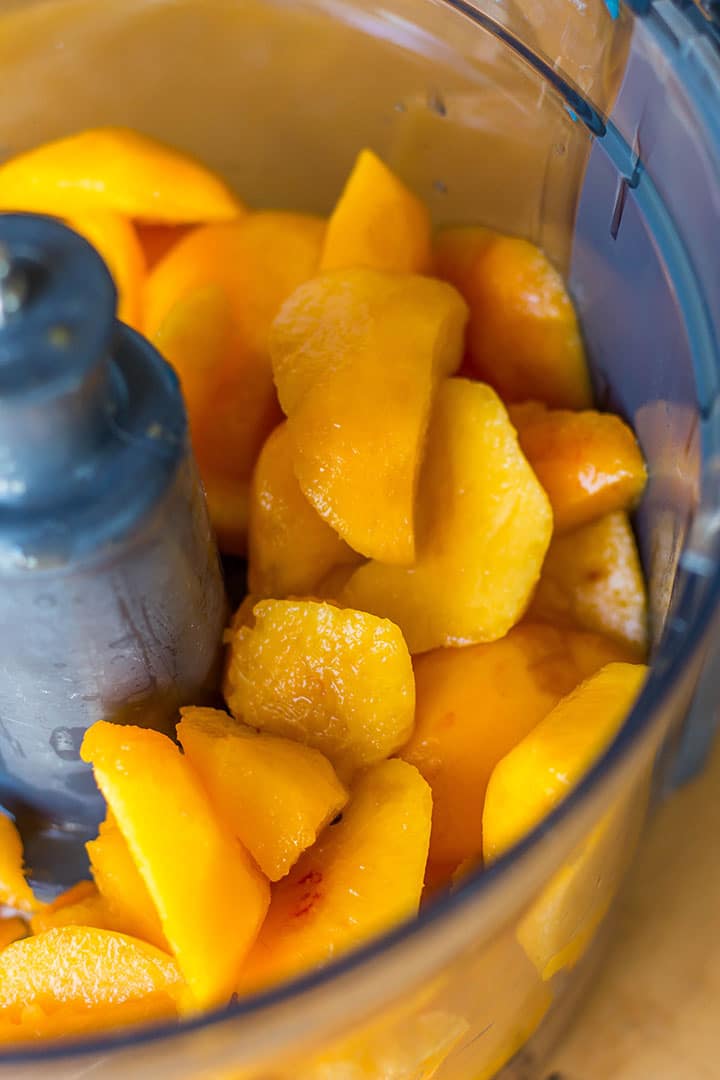 Peach wedges in a food processor bowl