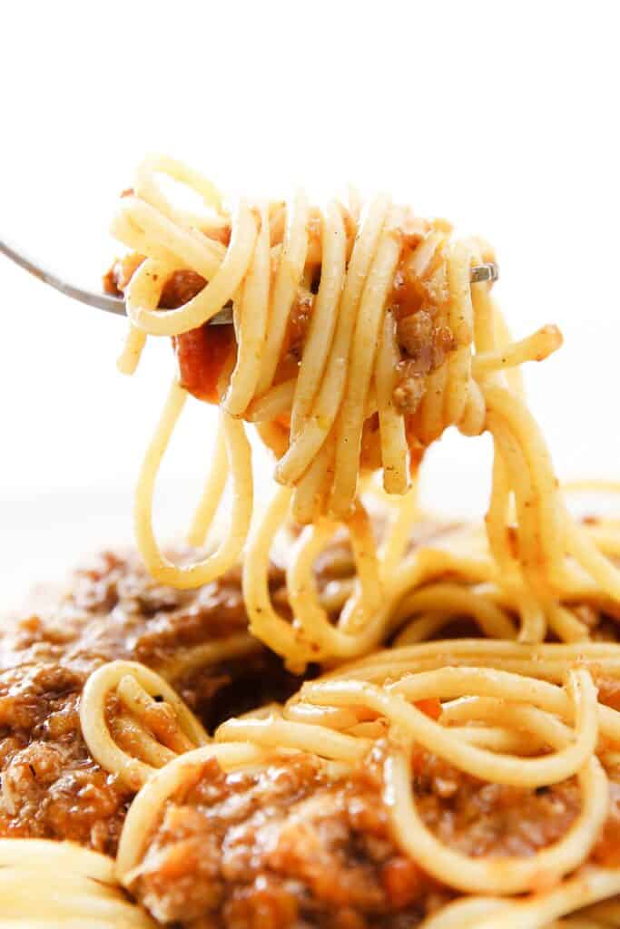 A forkful of Quick & Easy Spaghetti Bolognese ready to eat