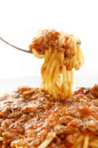 A forkful of Quick & Easy Spaghetti Bolognese ready to eat.