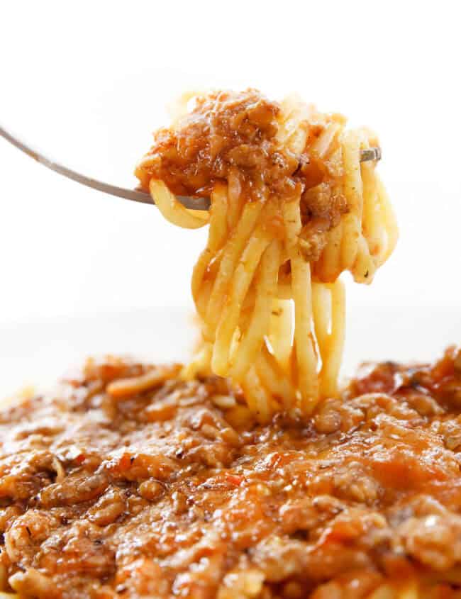 A forkful of Quick & Easy Spaghetti Bolognese ready to eat.