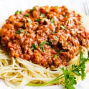 a plate of Spaghetti topped with Bolognese sauce