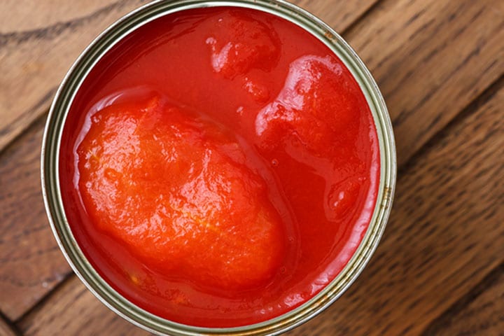 An open Whole can of tomatoes from above on