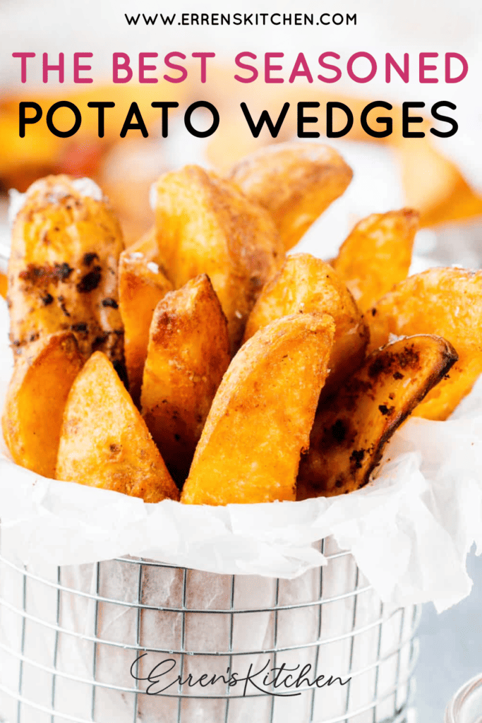 A basket of crispy, seasoned potato wedges.