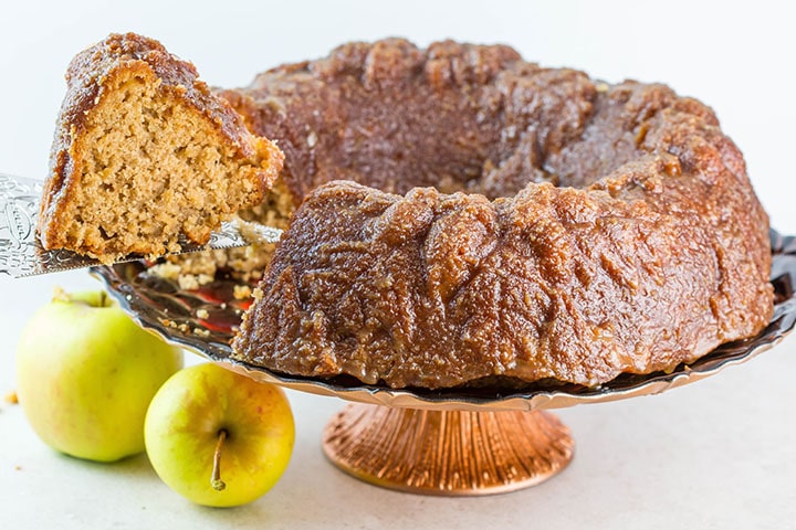 Caramel Apple Bundt Cake being cut and served