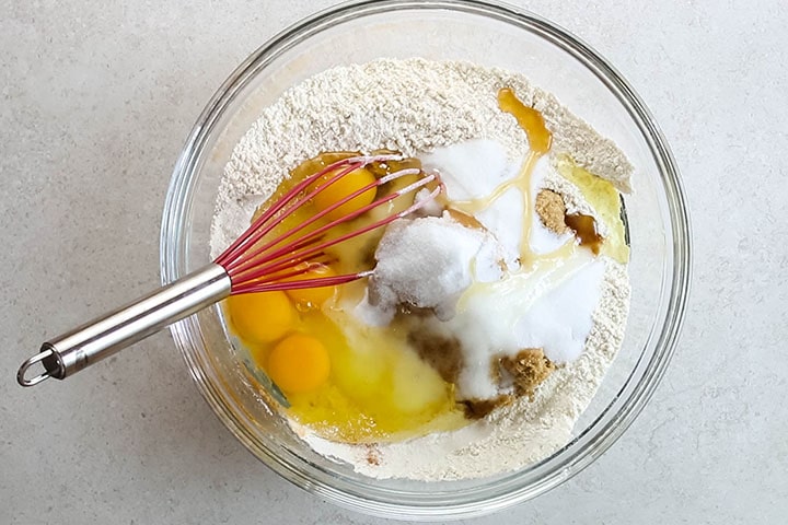 the brown sugar, granulated sugar, eggs, and vanilla added to the bowl