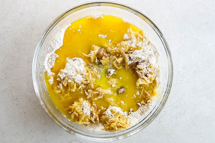 Melted butter added to the bowl with the other ingredients