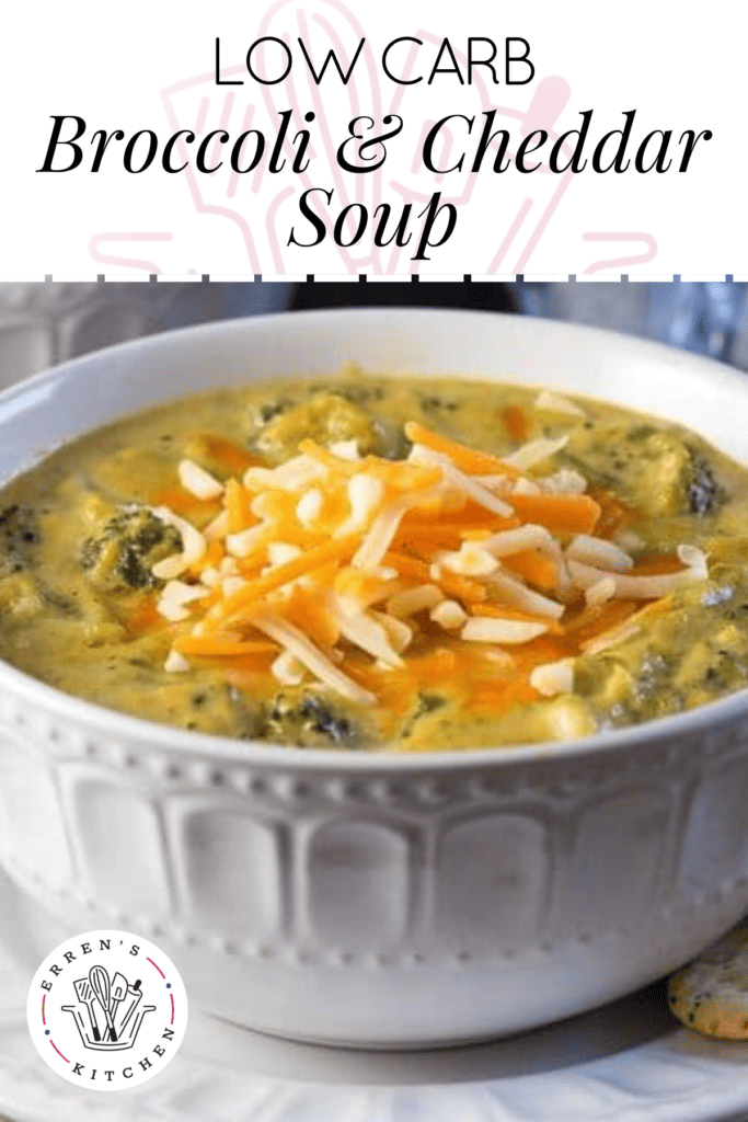 A warm bowl of broccoli cheddar soup with pieces of cooked broccoli and a handful of shredded cheddar cheese topped in the center of the bowl.