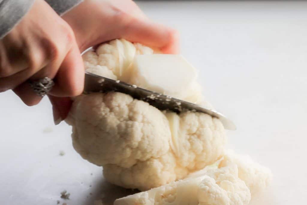 a knife going through a head of cauliflower