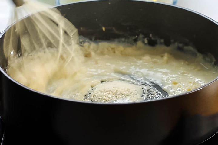 The Parmesan Cheese added to the pan with the milk mixture