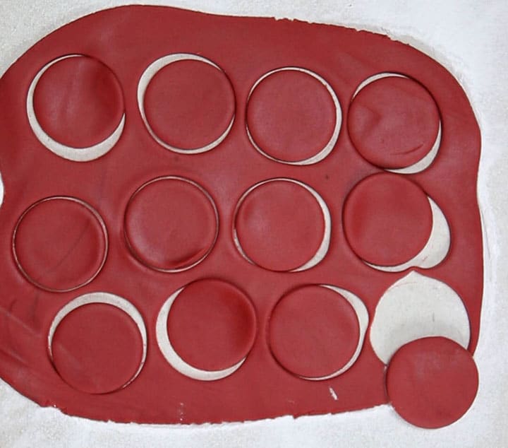 The red fondant icing with rounds cut out of it