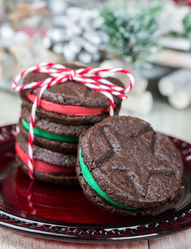 A stack of Homemade Oreo Christmas Cookies with one leaning against them