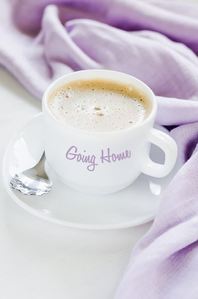 White cup of morning coffee or cappuccino. Cozy breakfast.