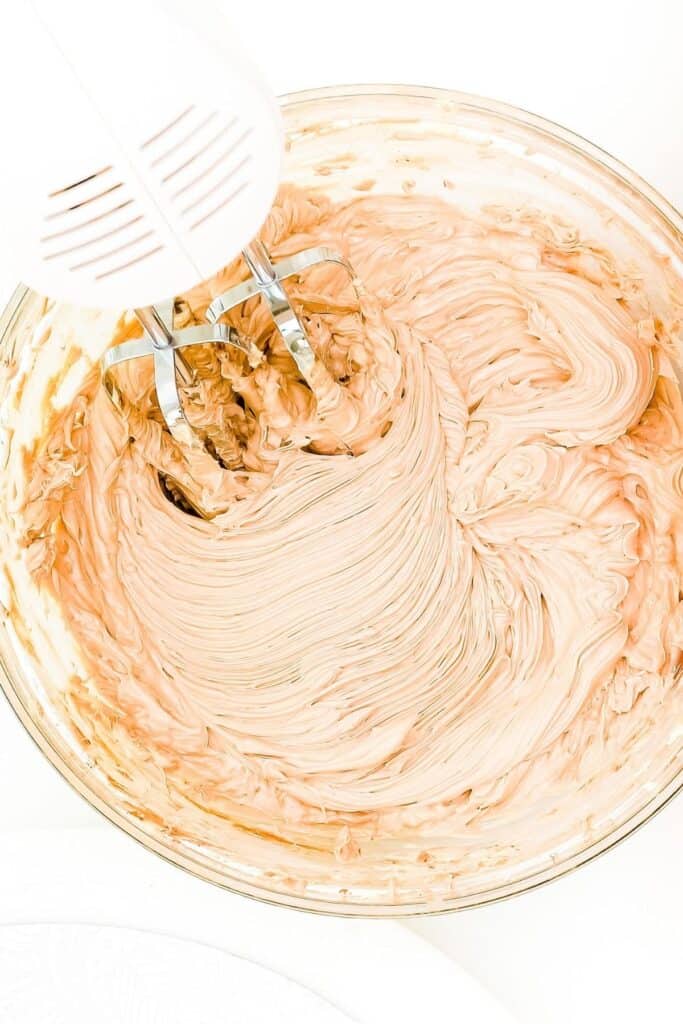 Chocolate Whipped Cream whipped in a bowl with a mixer