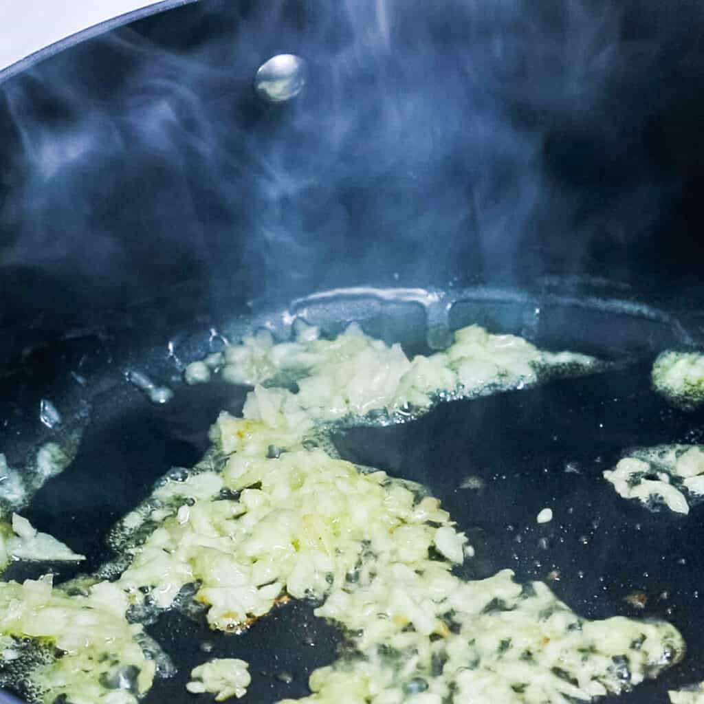 shallots and garlic cooking in butter