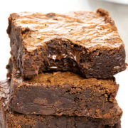 Easy Chocolate Brownies stacked 3 high with a bite taken from the top one
