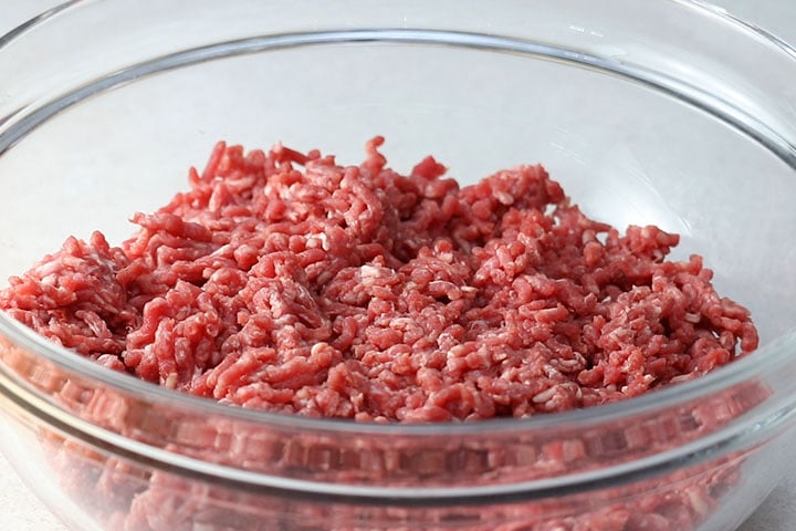 Ground beef in a large mixing bowl