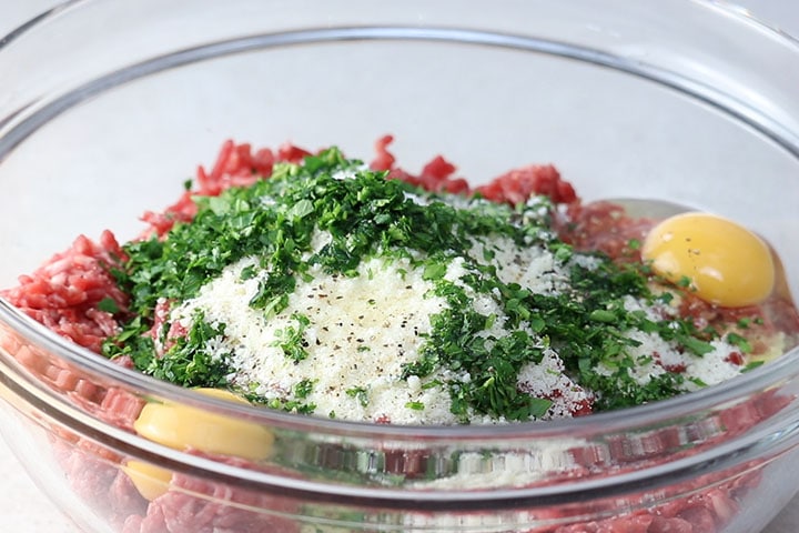 Eggs parsley and seasoning added to the meatball mixture. 