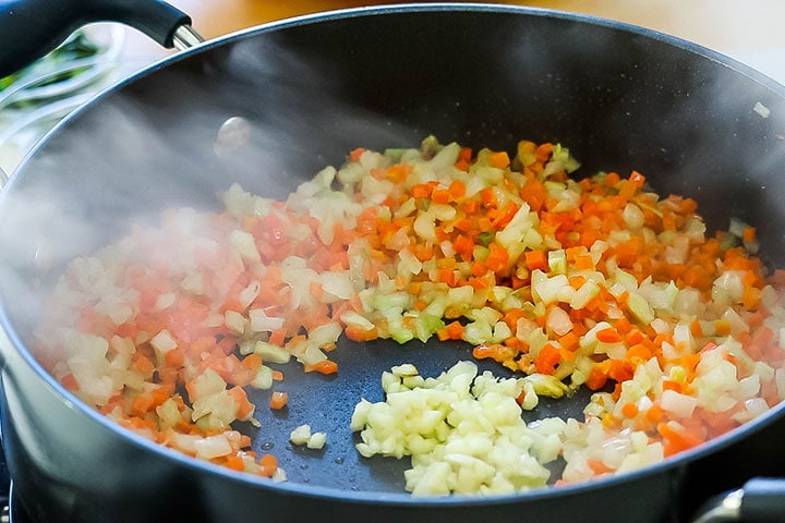 Garlic cooking in the well of the other vegetables 