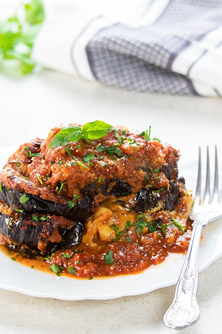 A close up of a plate of food, with Eggplant and Basil