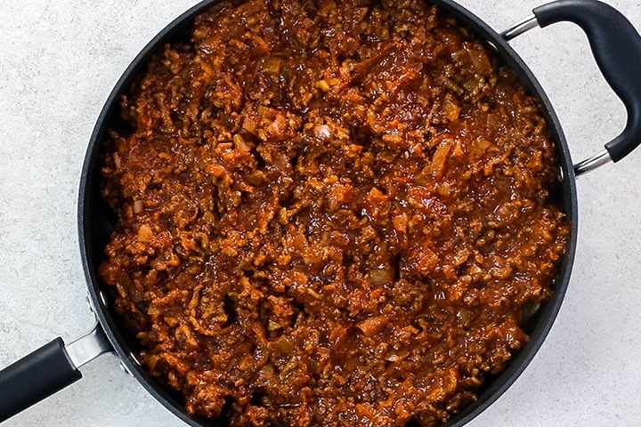 Meat sauce added to the pan with the eggplant