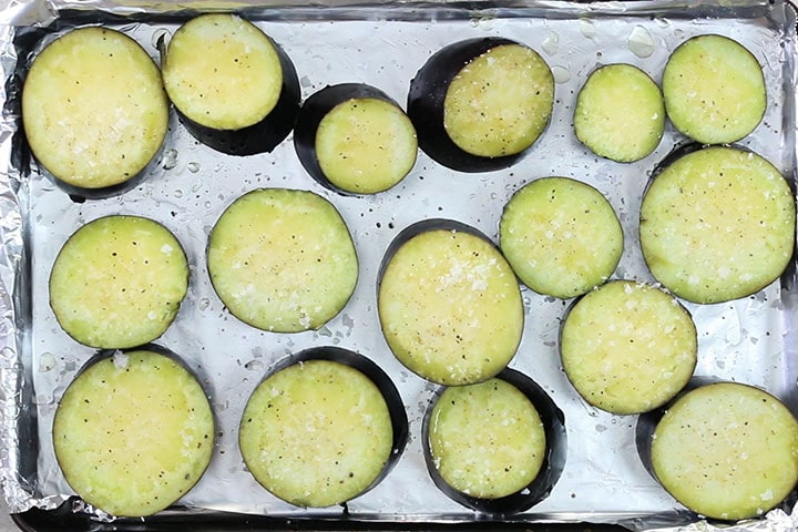 eggplant slices coated with olive oil and seasoned with salt and pepper