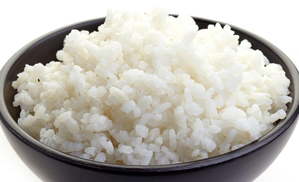 white rice in a black bowl