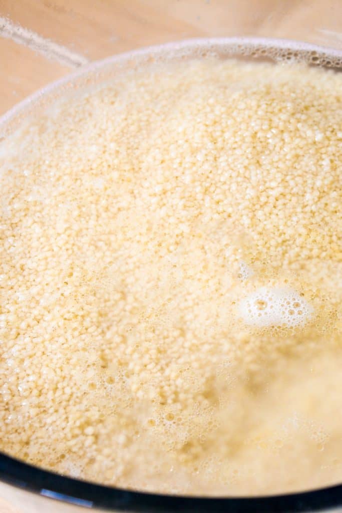 couscous in a bowl with hot water poured into it