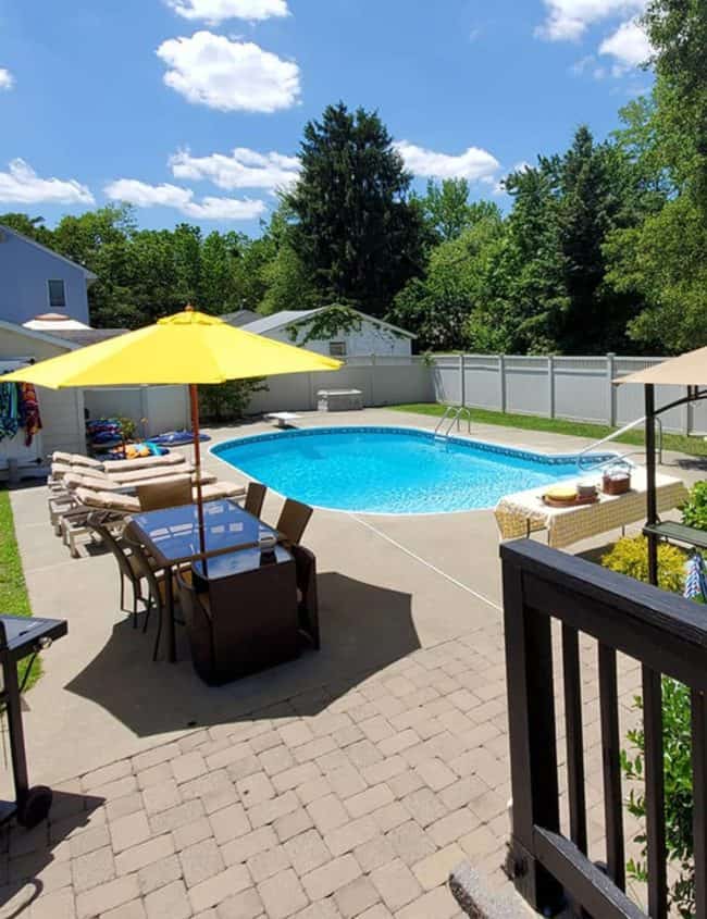 a picture of a backyrad with a pool setup for a party