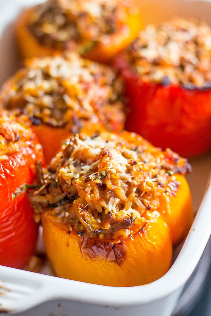 Italian Stuffed Peppers arranged in a white baking dish