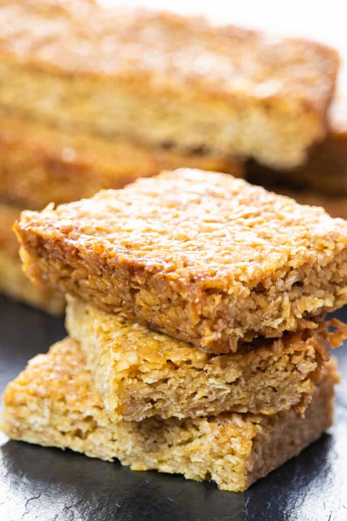 stacked flapjacks with more uncut in the background