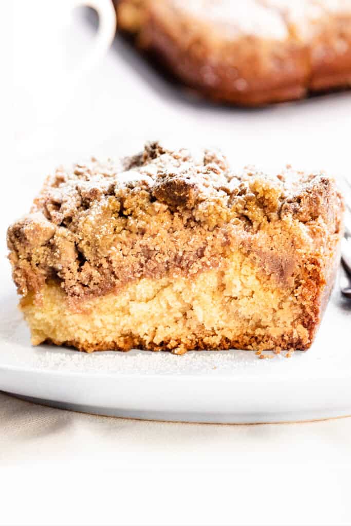 Crumb Coffee Cake with a thick crumb topping and topped with powdered sugar