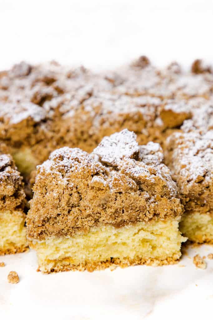 a Crumb Coffee Cake with a slice cut from it