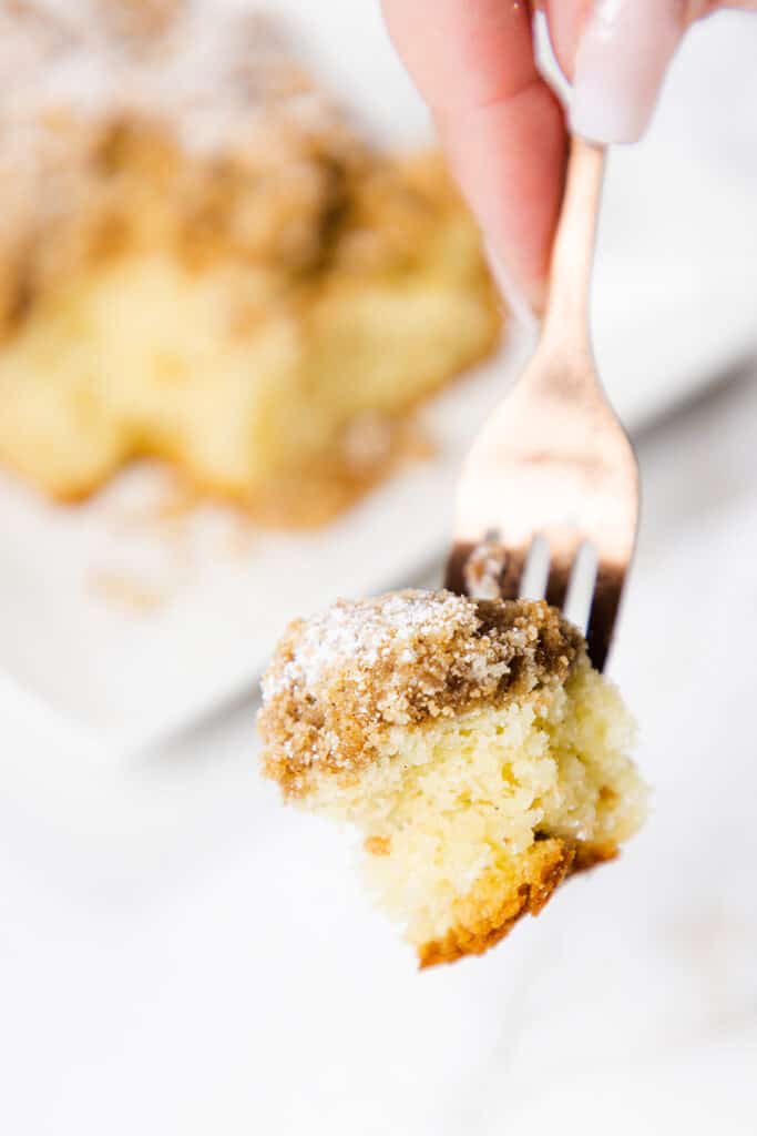 a fork holding a bite of Crumb Coffee Cake