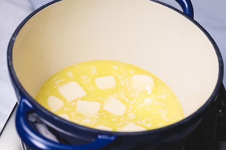 Butter melting in a pot with milk and cream