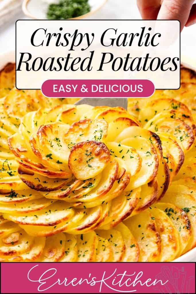 A dish of thinly sliced, golden Crispy Garlic Roasted Potatoes arranged in a spiral, garnished with chopped herbs. Text reads, "Crispy Garlic Roasted Potatoes - Easy & Delicious - Erren's Kitchen.
