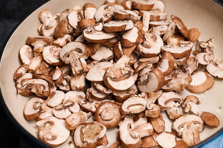 a pan with sliced mushrooms