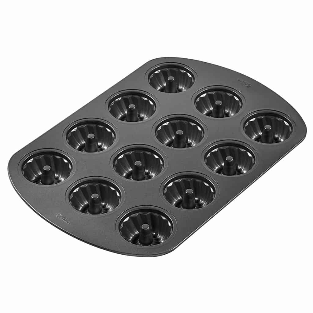 A Wilton Mini Fluted Tube Pan with a white background