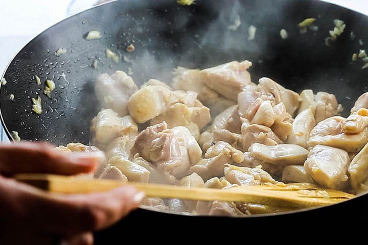 chicken cooking with the garlic abd ginger