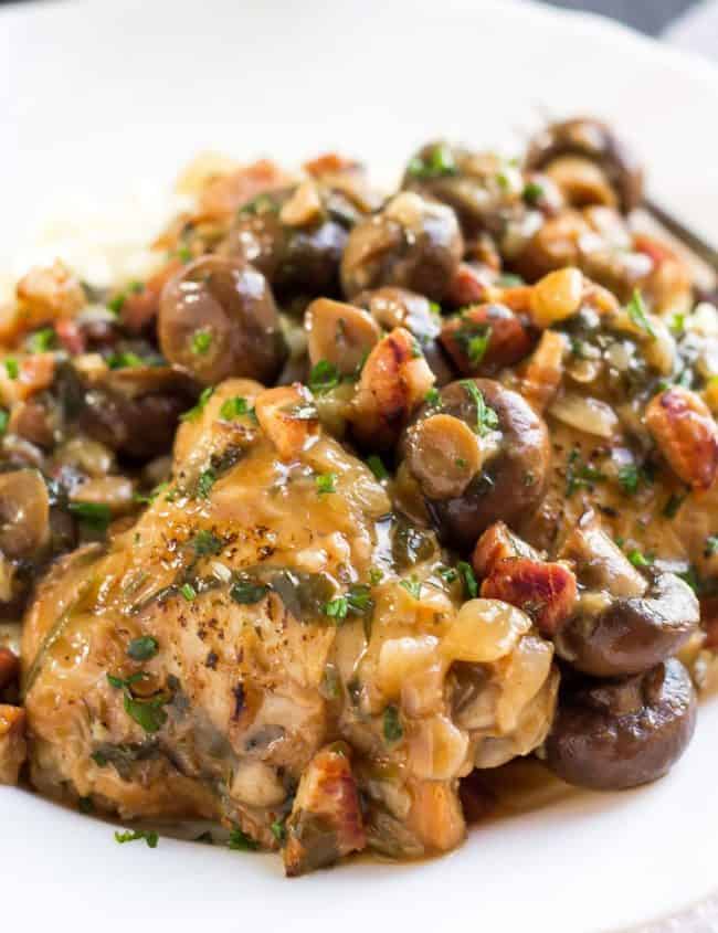 Chicken with Sherry Mushrooms Sauce piled high on a white plate