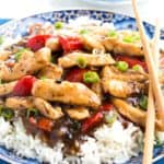 Chicken with Black Bean Sauce piled high on a bed of rice