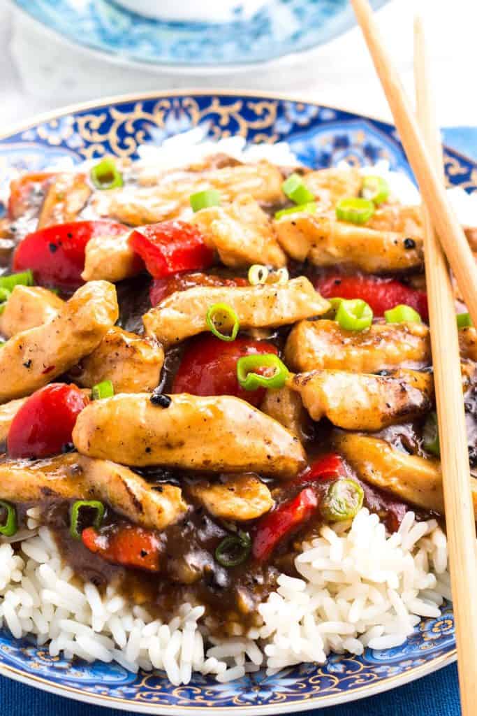 Chicken with Black Bean Sauce piled high on a bed of rice