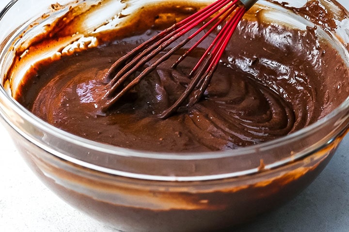 Chocolate batter being mixed in a bowl