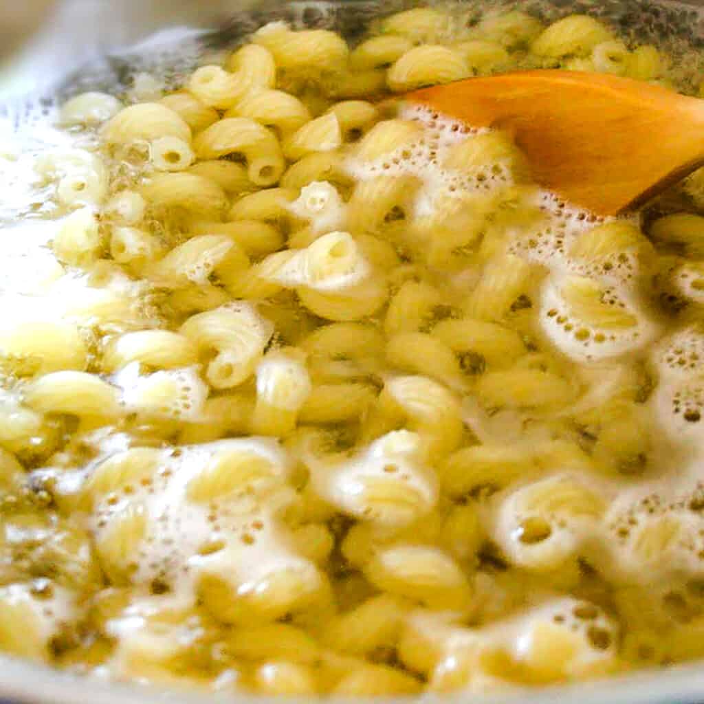 pasta cooking in a pot of boiling water