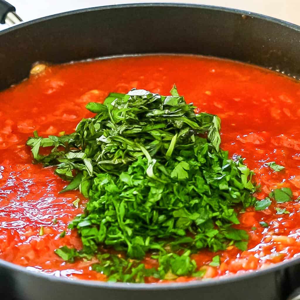 the parsley added to the pan with the sauce.